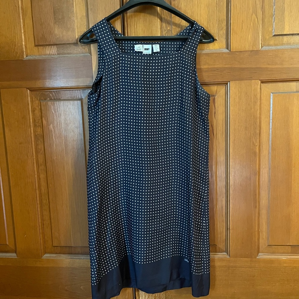 DKNY sleeveless silk navy with white polka dots, hits above the knee